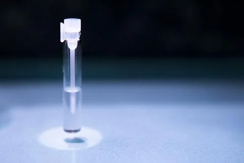 Glass bottle with perfume sample Stock Photos