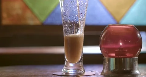 A glass bottle sitting on a table Stock Footage 155461117