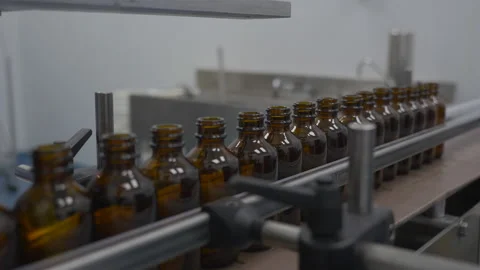 Glass Bottles Moving Down A Conveyor In Factory Stock Footage 137282334