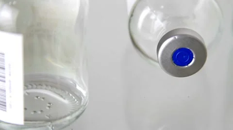 Glass bottles rotation Stock Footage 8576480