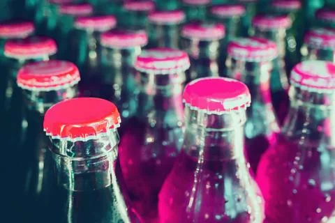 Glass bottles with soft drinks background Stock Photos