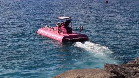 Glass bottom boat exploring the Atlantic coast Stock Footage 84756656