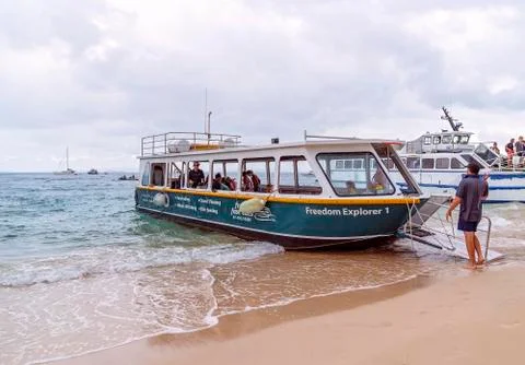 Glass Bottom Boat Loading Passengers For A Trip To View The Reef Stock Photos