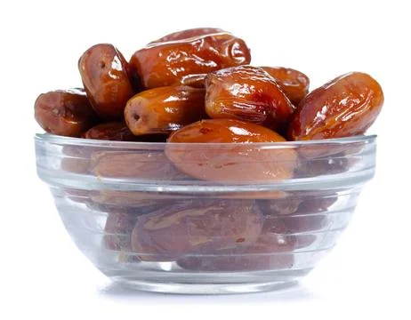 Glass bowl with dates Stock Photos