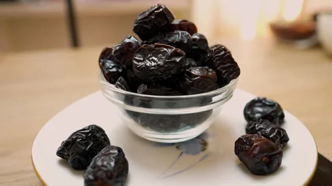 Glass Bowl of Dried Dates on a Plate Stock Footage 320727853