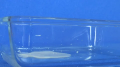 Glass bowl filled up with milk Stock Footage