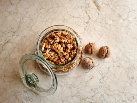 Glass bowl with walnuts Stock Photos