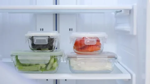 Glass boxes with vegetables in refrigerator, concept food storage. Stock Footage 285281066