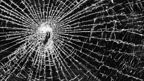 Glass breaking into pieces. Video stock 323407734