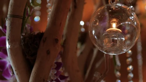 Glass bubble holding candle close up Video stock 109097944