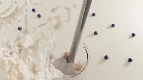 Glass of bubble milk tea, milkshake or chocolate cocktail with straws top view Stock Footage 154242700