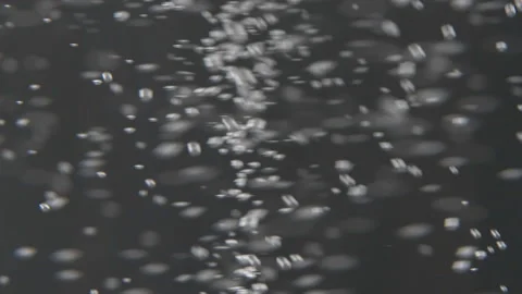 Glass with bubbles going up in slow motion on black background 스톡 동영상 134916319
