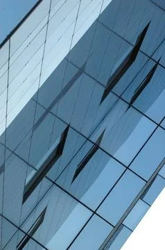 Glass building facade with abstract reflections Stock Photos