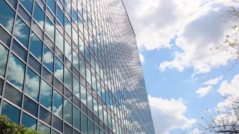 Glass building. Reflection of the sky on the windows of the building 스톡 동영상 241639144