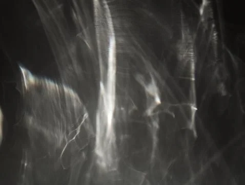 Glass caustics in dark space 스톡 사진