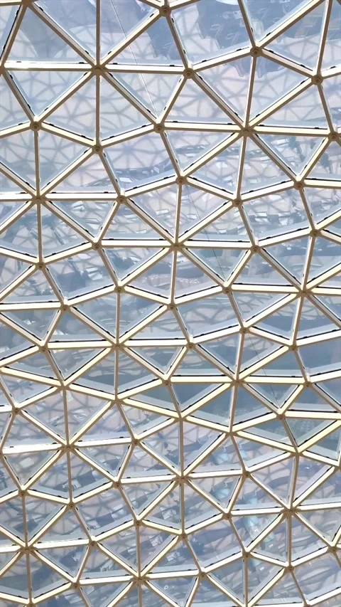 Glass ceiling with geometric triangular design reflecting modern architecture Stock Footage 284858592