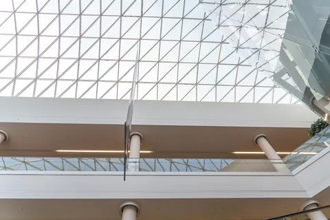 The glass ceiling in the mall from the inside. The interior of the shopping c Stock Photos