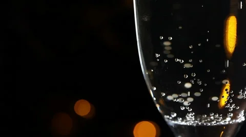 Glass of champagne on a black background Видео 58034429