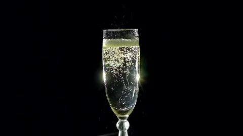 Glass of champagne with bubbles. Stock Footage 73380317