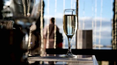 A glass of champagne in the restaurant on the table. Stock Footage 165587342