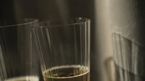 Glass of champagne with soft light reflection Stock Footage 312748464