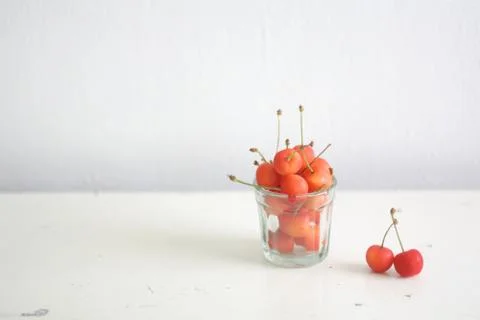 Glass of cherries Stock Photos