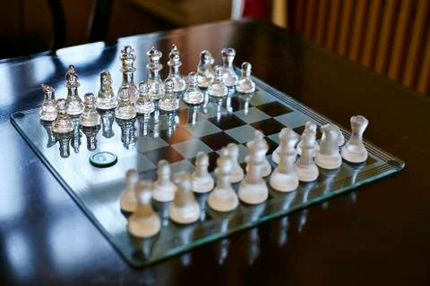 Glass chess on the table Stock Photos