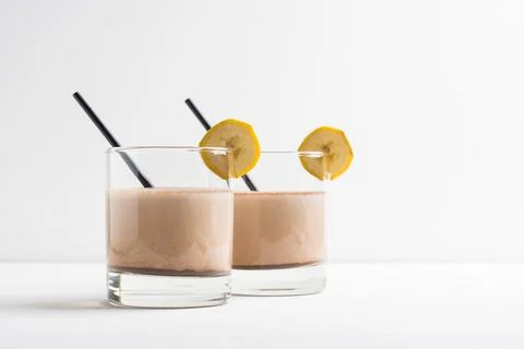 Glass of chocolate milkshake on the table Stock Photos