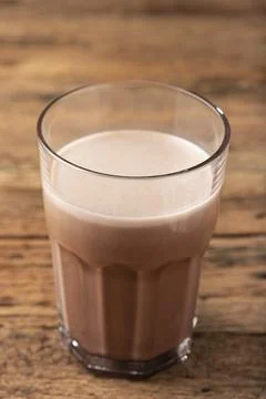 Glass with chocolate on the table. Stock Photos
