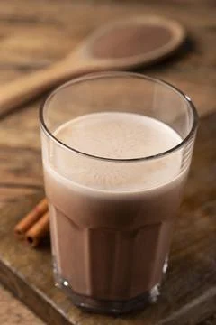 Glass with chocolate on the table. Stock Photos