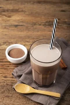 Glass with chocolate on the table. Stock Photos