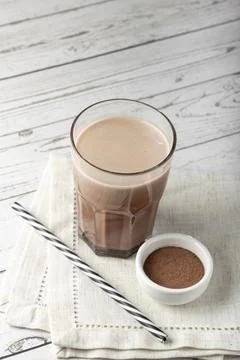 Glass with chocolate on the table. Stock Photos