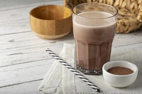 Glass with chocolate on the table. Stock Photos