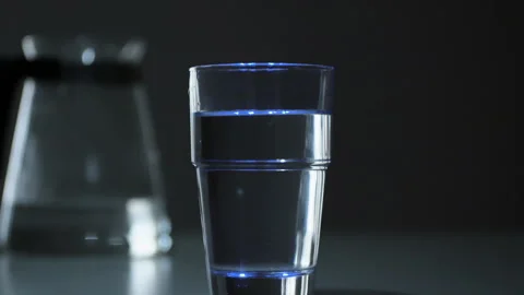 A glass of clean drinking water is on the table. Stock Footage 262748595