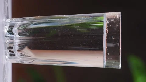 Glass with clean drinking water.  Vertical video reels Stock Footage 239255830