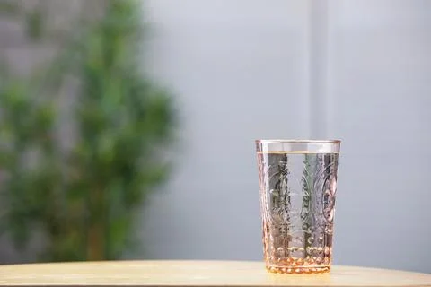 Glass of clean water on wooden table indoors, space for text Stock Photos