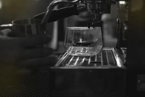 Glass of coffee put on machine,prepare for extract, Stock Photos
