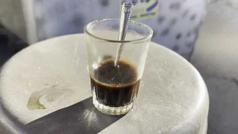 Glass of coffee with a spoon Stock Footage 272160656