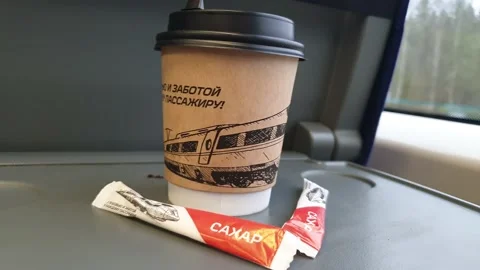 Glass with coffee on the train close-up. Stock Footage 153861917
