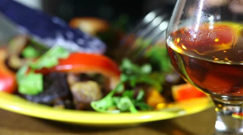 Glass of cognac and dinner Stock-Footage 34645587