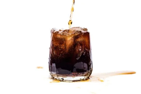 Glass of cola with ice cubes isolate Stock Photos