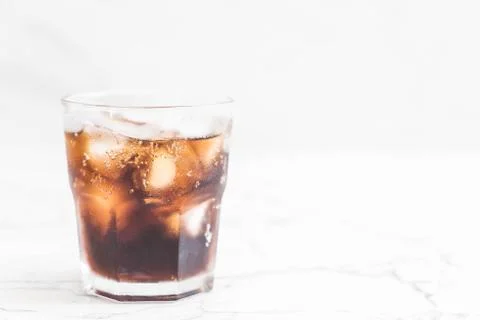 Glass of cola with ice Stock Photos
