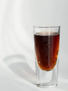 Glass of cola on white background Foto stock