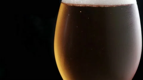 Glass with cold beer. bubbles air. Stock footage. copy space Stock Footage 133732061