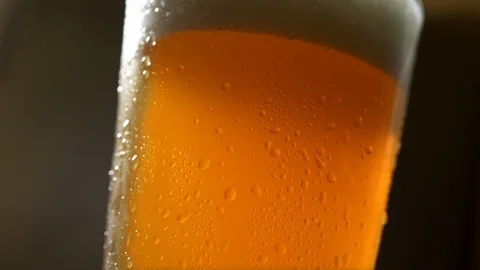 Glass of Cold Beer Close Up Rotating Stock Footage 100444453