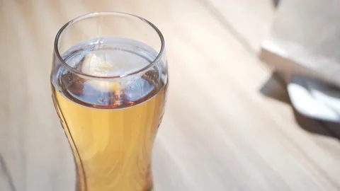 Glass with cold beer on the table. Video stock 157287085