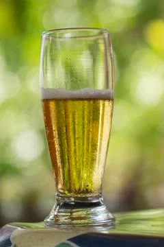 Glass of cold beer on the table. Stock Photos