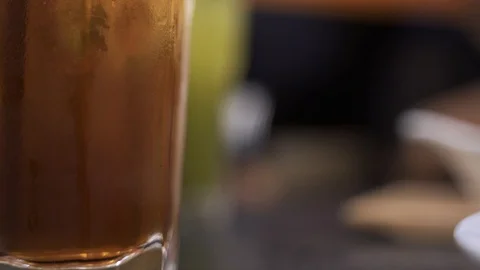 Glass of cold iced tea Stock Footage 119696744