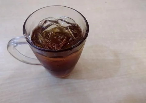 A glass of cold iced tea Stock Photos