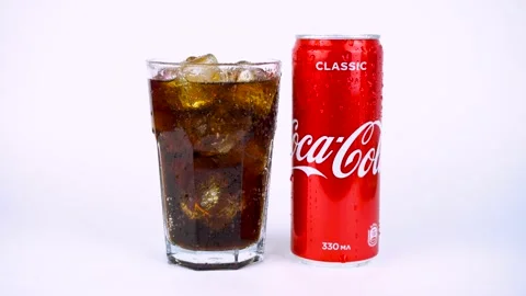 Glass of cold refreshing coca cola soda with ice, metal can of coca-cola classic Stock Footage 138019271